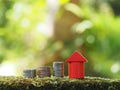 Growth coin stack with red house model. Savings budget plan for house. Investment mortgage fund finance property, home loan Royalty Free Stock Photo