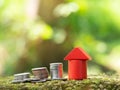 Growth coin stack with red house model. Savings budget plan for house. Investment mortgage fund finance property, home loan Royalty Free Stock Photo