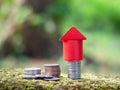 Growth coin stack with red house model. Savings budget plan for house. Investment mortgage fund finance property, home loan Royalty Free Stock Photo