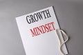 GROWTH MINDSET text on white folder on grey background Royalty Free Stock Photo