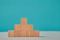 Growth process. Career ladder. Success development. Growth and progress. Pyramid of wooden cubes mockup with copy space Royalty Free Stock Photo