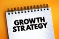 Growth Strategy text on notepad, concept background Royalty Free Stock Photo