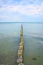 Groynes on the beach of the Baltic Sea in Zingst. calm water on the coast Royalty Free Stock Photo