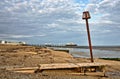 Groynes and post on Worthing beach Royalty Free Stock Photo