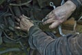 Grubby man working on brakes of a car Royalty Free Stock Photo