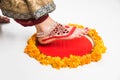 Gruha Pravesh / Gruhapravesh / Griha Pravesh, closeup picture of right feet of a Newly married Indian Hindu bride dipping her fit