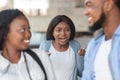 Grumpy black girl angry to her boyfriend flirting with another woman Royalty Free Stock Photo