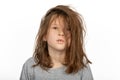 Grumpy Christmas Morning: Portrait of Young Girl with a Bad Hair Day on White Background Royalty Free Stock Photo