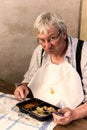 Grumpy man with tv dinner Royalty Free Stock Photo