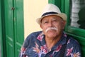 Grumpy senior Hispanic man portrait Royalty Free Stock Photo