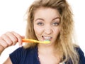 Grumpy tired woman brushing teeth, isolated