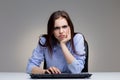 Grumpy woman using keyboard Royalty Free Stock Photo