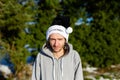 A grumpy young man wearing a black santa hat with the words Bah Humbug written on it Royalty Free Stock Photo