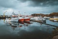 Grundarfjordur, Iceland - 03 January 2019: Harbor with motionless boats during the twilight of the afternoon, Kirkjufell