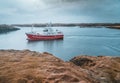 Grundarfjordur, Iceland - 03 January 2019: Harbor with motionless boats during the twilight of the afternoon, Kirkjufell