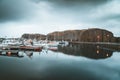 Grundarfjordur, Iceland - 03 January 2019: Harbor with motionless boats during the twilight of the afternoon, Kirkjufell