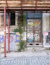 Grunge abandoned metal door and windoe with random paints, Istanbul