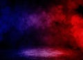 Studio dark room with fog or mist and lighting effect red and blue on concrete floor grunge texture background. Royalty Free Stock Photo