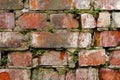 Grunge background Old brick wall weathered and falling apart. The cement interlayers between the bricks were covered Royalty Free Stock Photo