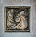 Grunge background with stone texture and bas-relief with ancient ornament