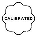 Grunge black calibrated word rubber stamp on white background