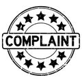 Grunge black complaint word with star icon rubber seal stamp on white background