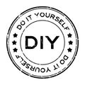Grunge black DIY word Abbreviation of Do it yourself round rubber stamp on white background