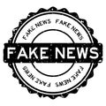 Grunge black fake news word round rubber stamp on white background Royalty Free Stock Photo