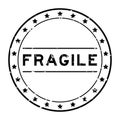 Grunge black fragile word round rubber stamp on white background