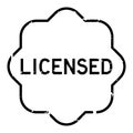 Grunge black licensed word rubber stamp on white background Royalty Free Stock Photo