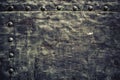 Grunge black metal plate with rivets screws background texture Royalty Free Stock Photo