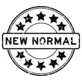 Grunge black new normal word with star icon round rubber stamp on white background