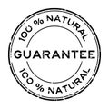 Grunge black 100 percent natural guarantee round rubber seal stamp on white background