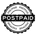 Grunge black postpaid word round rubber stamp on white background