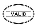 Grunge black valid word oval rubber stamp on white background