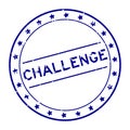 Grunge blue challenge word round rubber stamp on white background