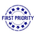 Grunge blue first priority word with star icon round rubber stamp on white background Royalty Free Stock Photo