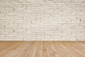 Grunge brick wall painted in light cream beige with wooden floor in yellow brown for interior backgrounds Royalty Free Stock Photo