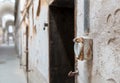 Grunge brick wall with rusty electric outlet. Royalty Free Stock Photo