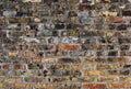 Grunge brick wall stained with mosses, mold and lichens. Close up