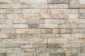 Grunge Brown stone wall tiles texture.