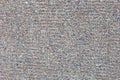 Grunge concrete surface decorated with small pebbles. Small stones wall texture for background usage. Rough backdrop Royalty Free Stock Photo