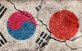 Grunge country flag illustration cracked concrete background / Japan vs South korea Political or economic conflict