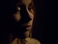 Grunge dark portrait of a sad teen girl. Royalty Free Stock Photo