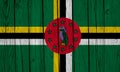 Dominica Flag Over Wood Planks