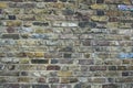 Grunge, english dirty old brick stone wall, outdoor building. Weathered textured pattern background with copy space for text Royalty Free Stock Photo