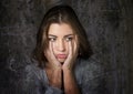 Grunge expressive head portrait of young beautiful and sweet blue eyes woman looking sad and depressed devastated in sadness emoti Royalty Free Stock Photo