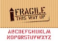 Grunge Fragile box sign with arrow up on piece of cardboard for cargo and alphabet. Vector stencil font