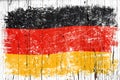 Grunge German flag over old white painted wood Royalty Free Stock Photo