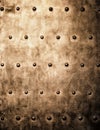 Grunge gold brown metal plate rivets screws background texture Royalty Free Stock Photo